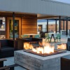 rooftop patio with chairs fire pit and seating