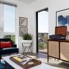 living room with chair tables and windows