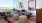 a living room with a couch and chairs