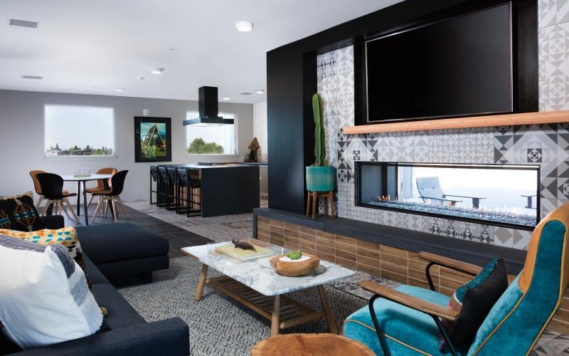 area of lounge where seating faces a large TV