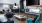 area of lounge where seating faces a large TV