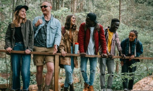 Find your perfect fit at Cook Street a group of people standing on a bridge over a river